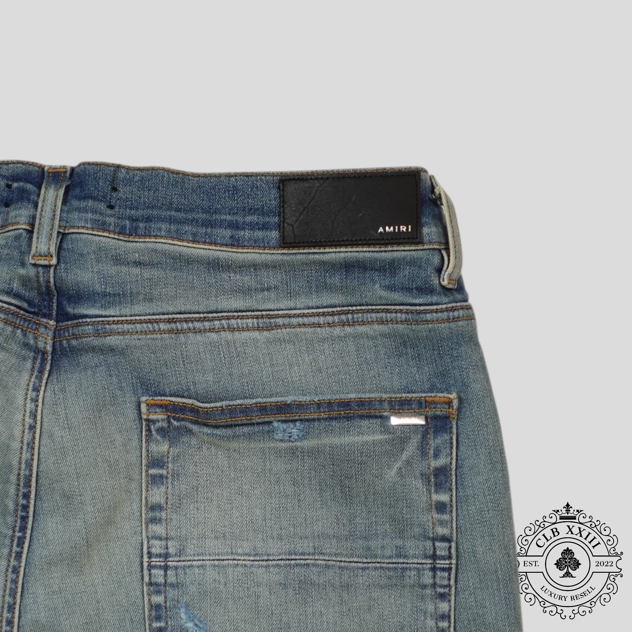 Jeans Amiri MX1 Camo Patch en indigo argileux