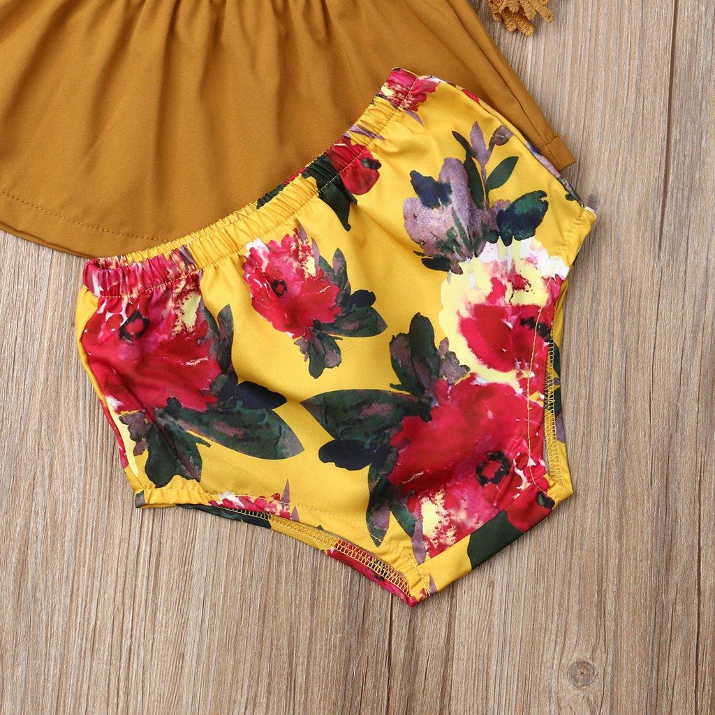 Tenues élégantes de luxe fleuries pour bébés filles nouveau-nés et tout-petits, comprenant un haut solide à épaules dénudées, un short fleuri et un bandeau avec nœud.