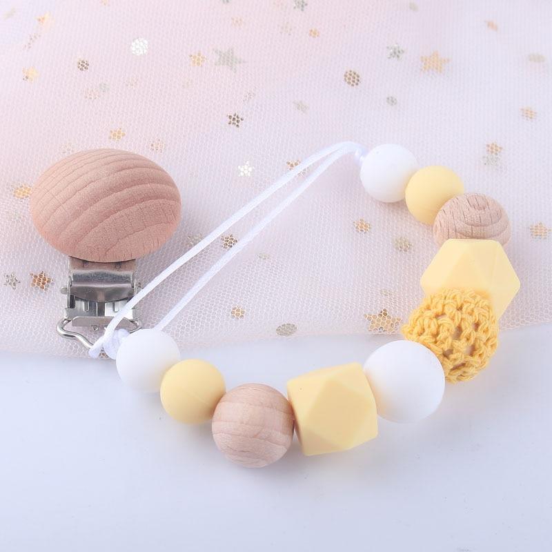 Support en bois moderne fait main pour attaches-sucettes, sangle de laisse, support de tétine pour l'alimentation de bébé