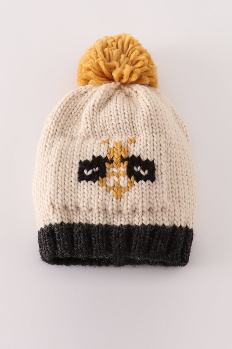 Bonnet torsadé beige avec pompon abeille