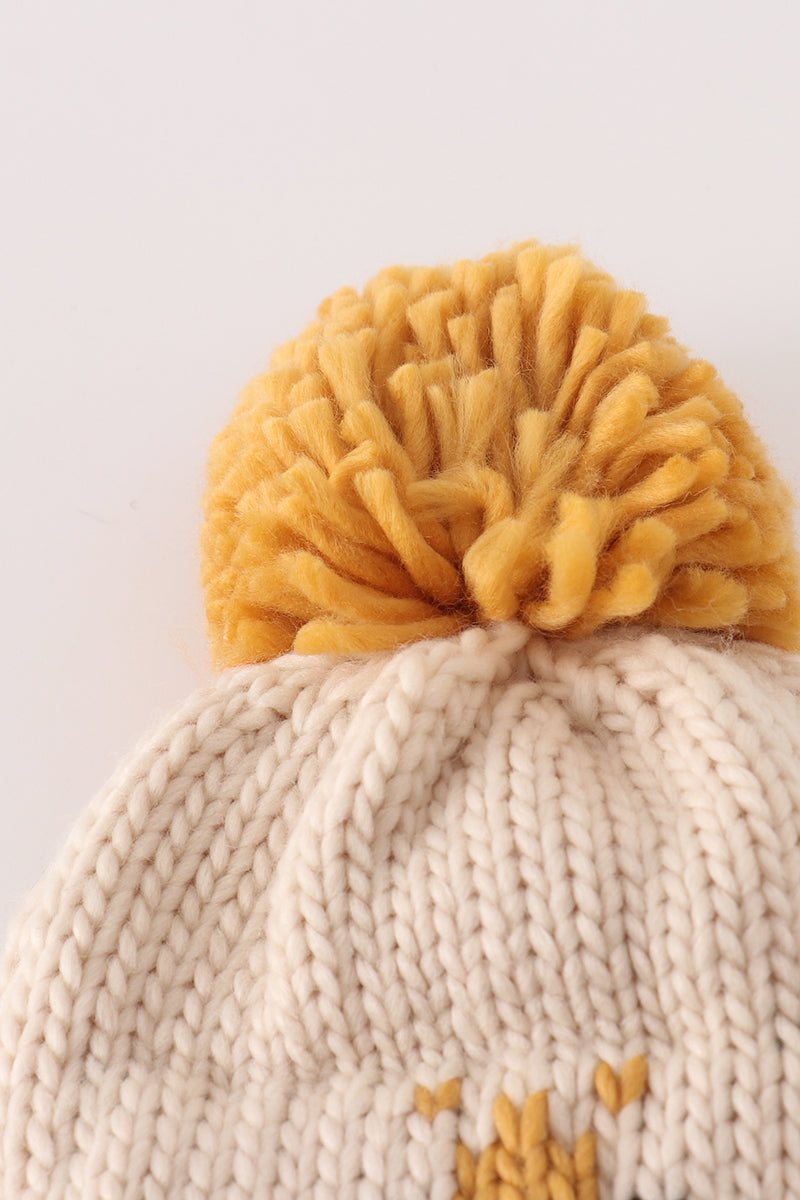 Bonnet torsadé beige avec pompon abeille