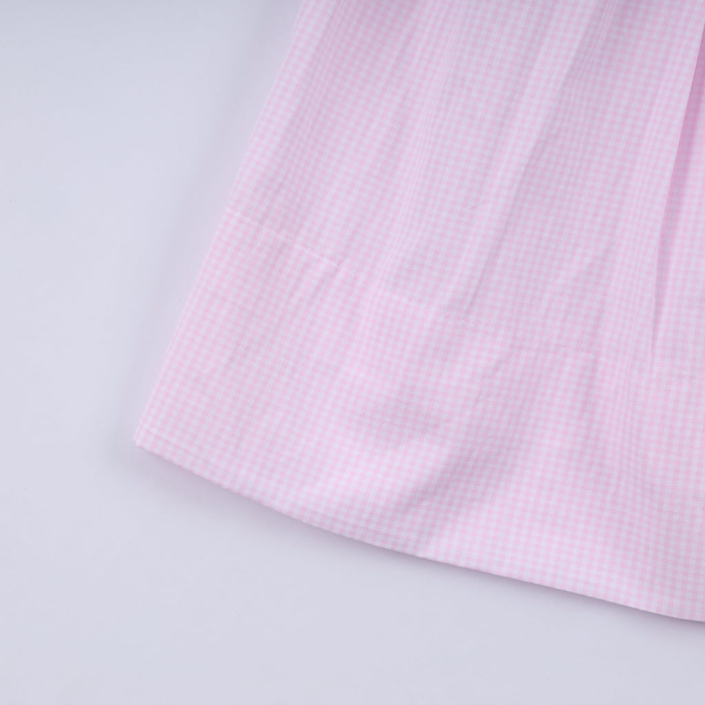 Robe rose à smocks faite main pour Noël