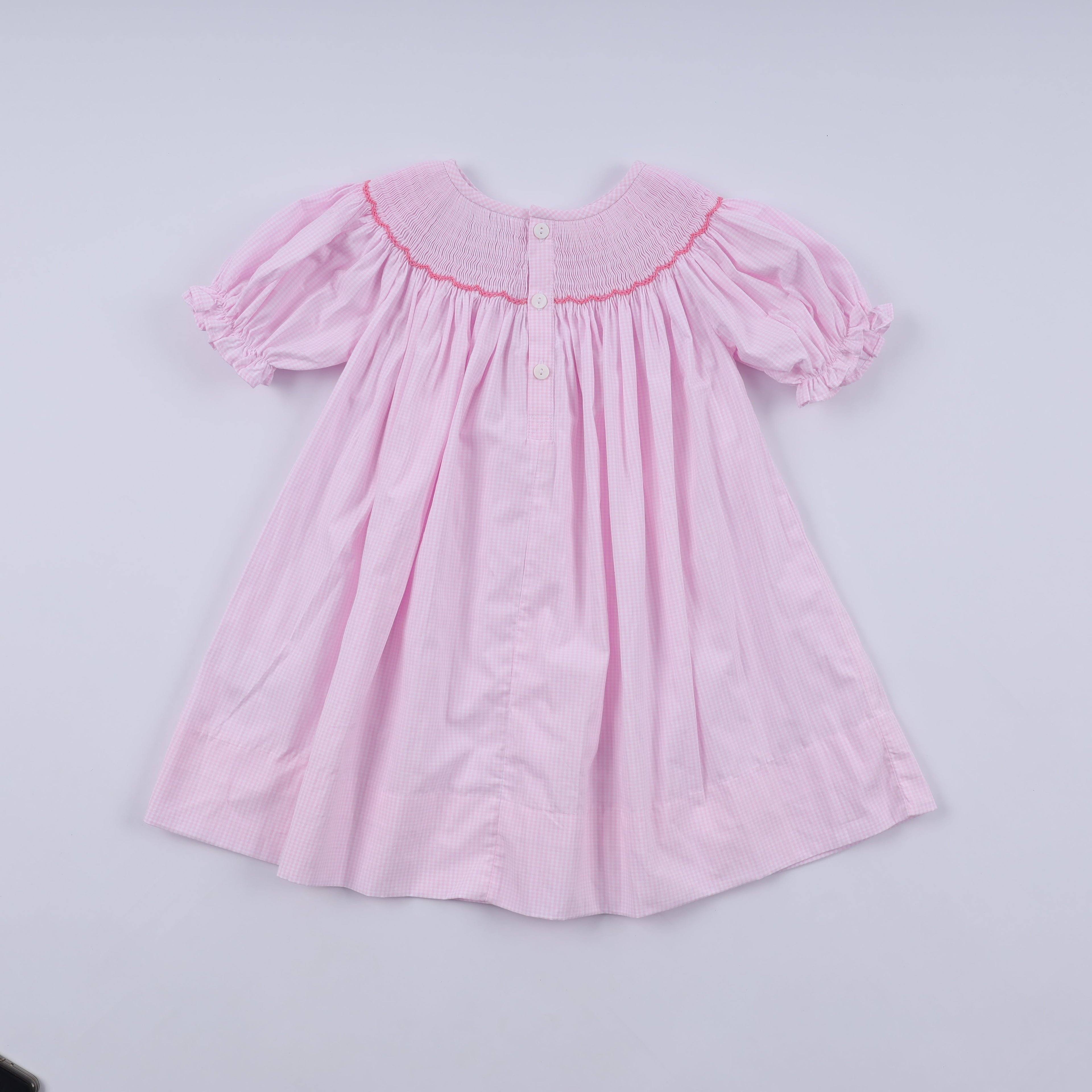 Robe rose à smocks faite main pour Noël
