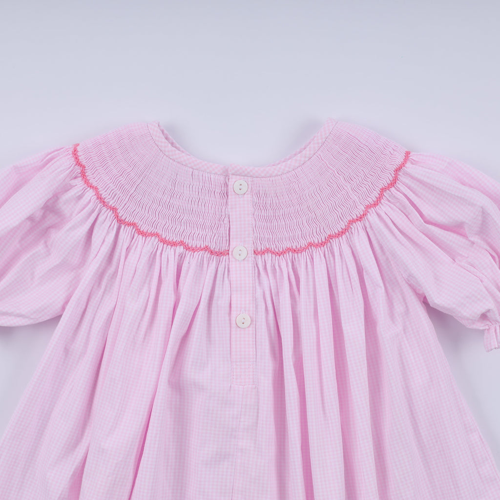 Robe rose à smocks faite main pour Noël