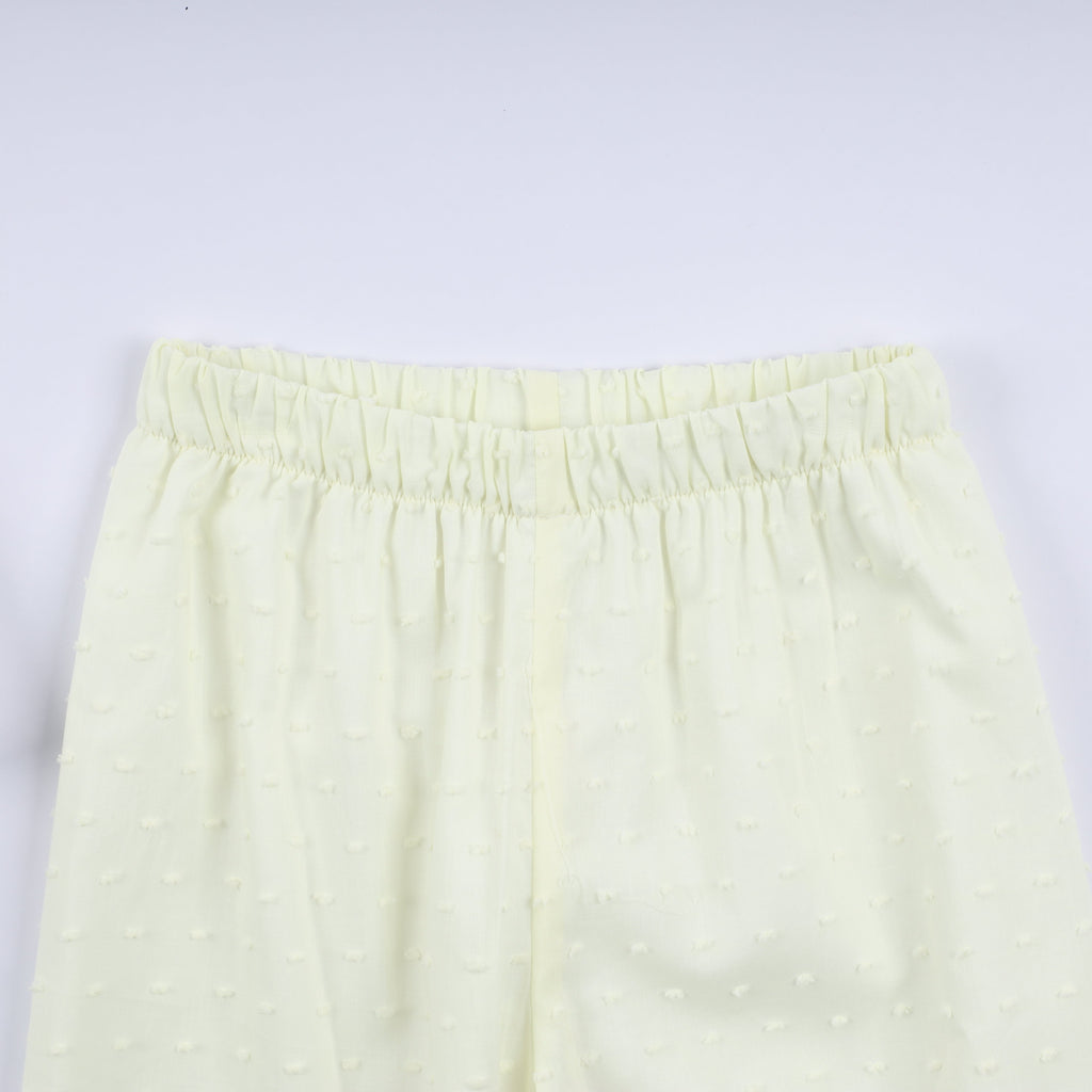 Ensemble pantalon à volants et main smockée en moutarde