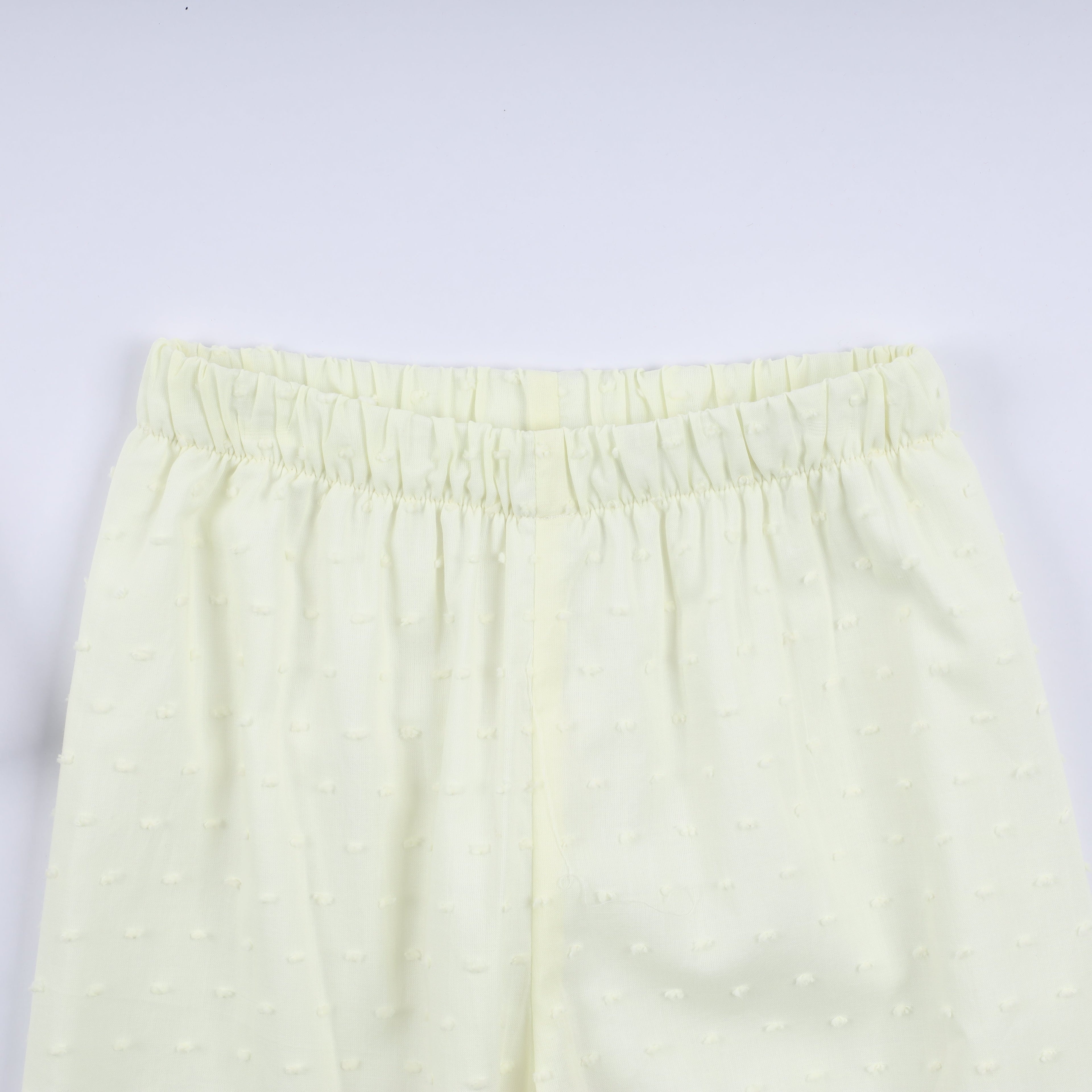 Ensemble pantalon à volants et main smockée en moutarde