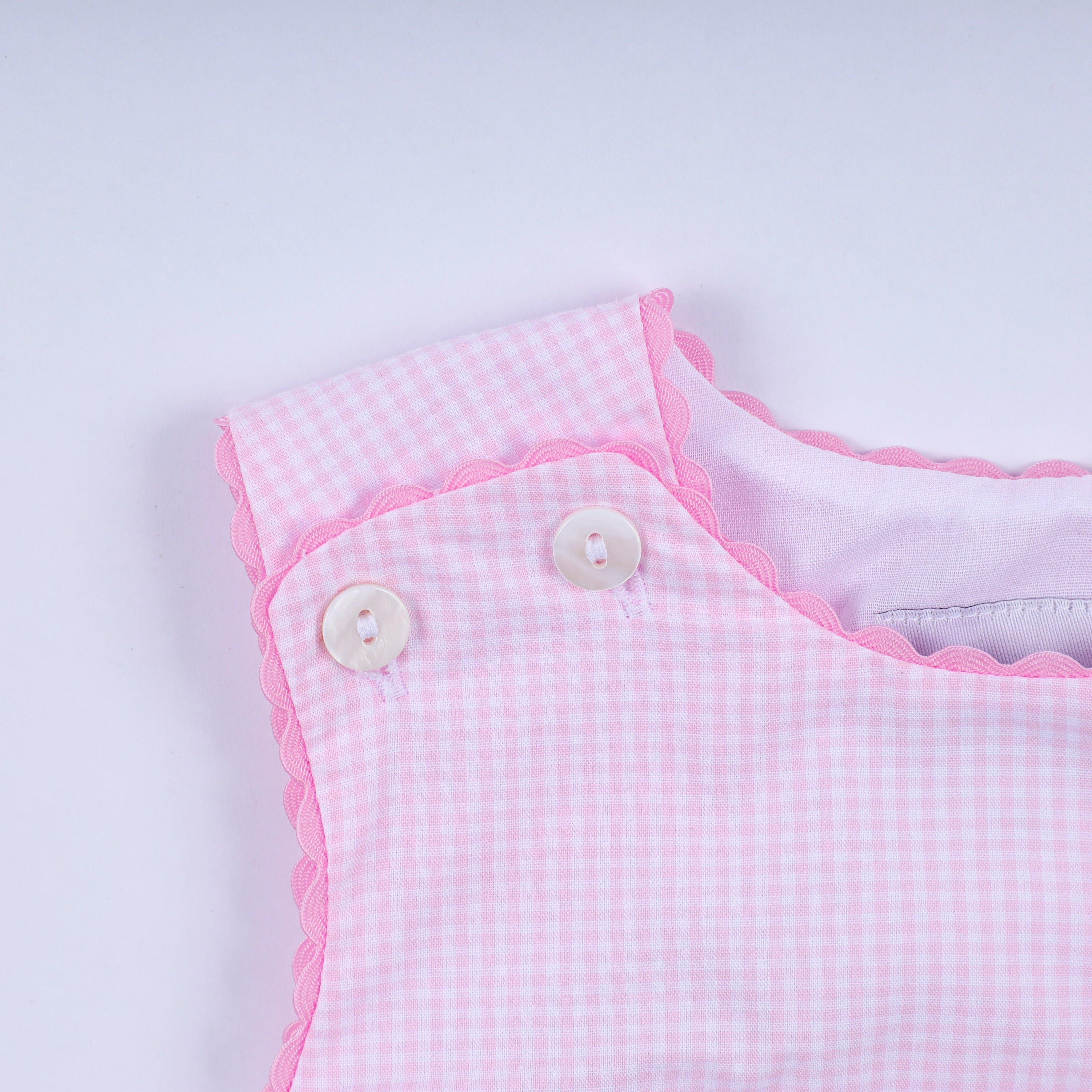 Barbotteuse écossaise à smocks main princesse rose