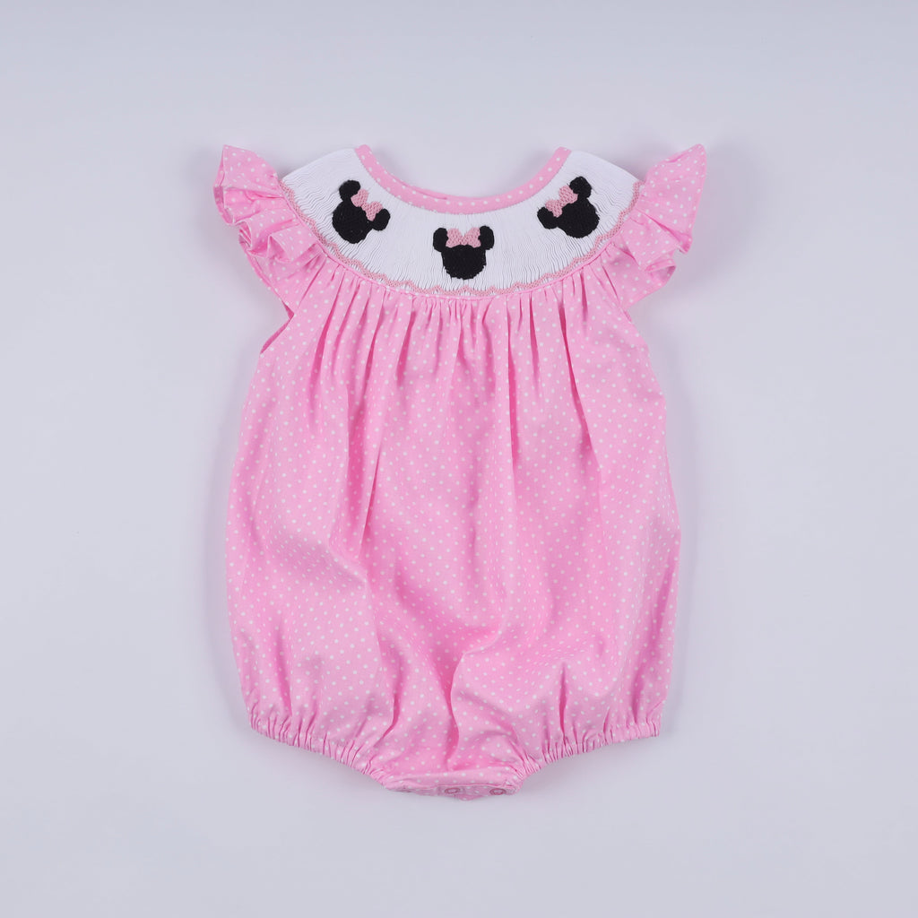 Barboteuse rose à smocks main, pois et volants