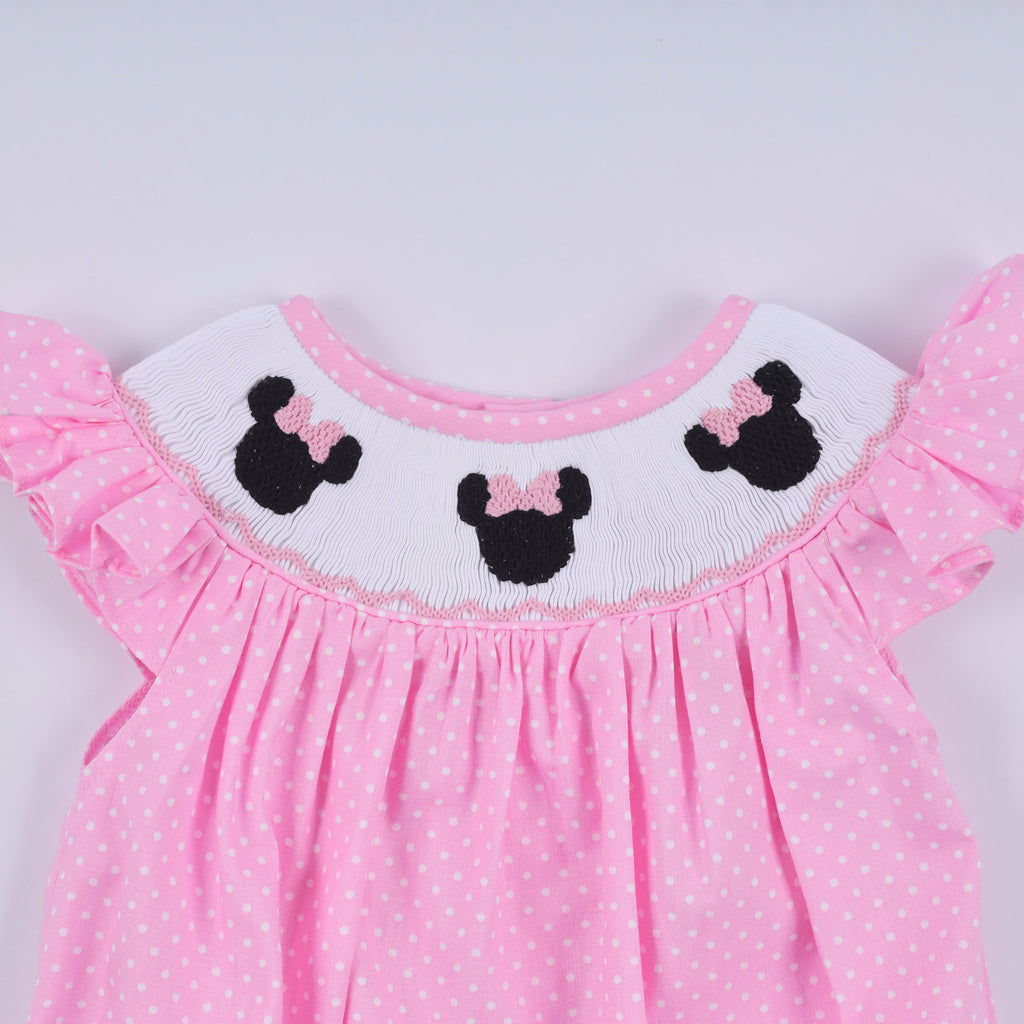 Barboteuse rose à smocks main, pois et volants
