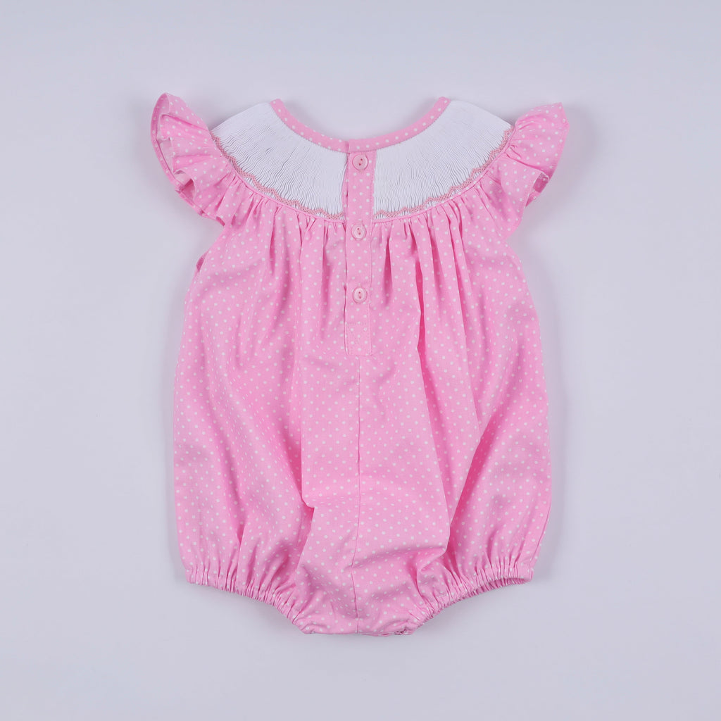 Barboteuse rose à smocks main, pois et volants