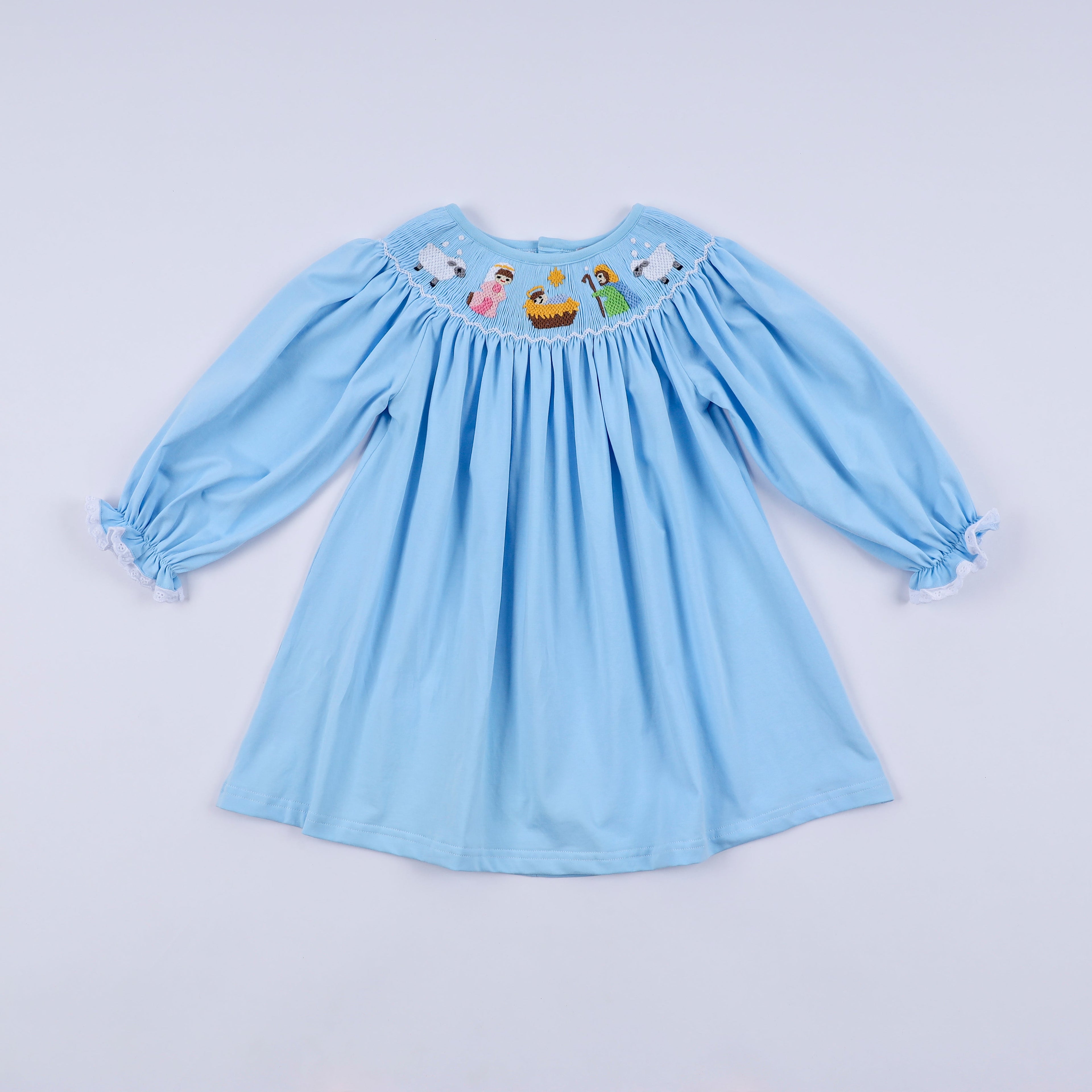 Robe bleue smockée à la main Nativité