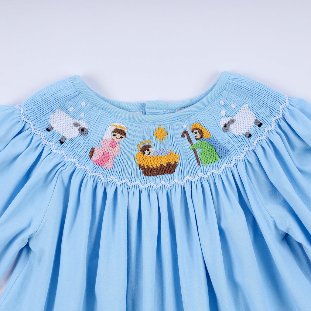 Robe bleue smockée à la main Nativité