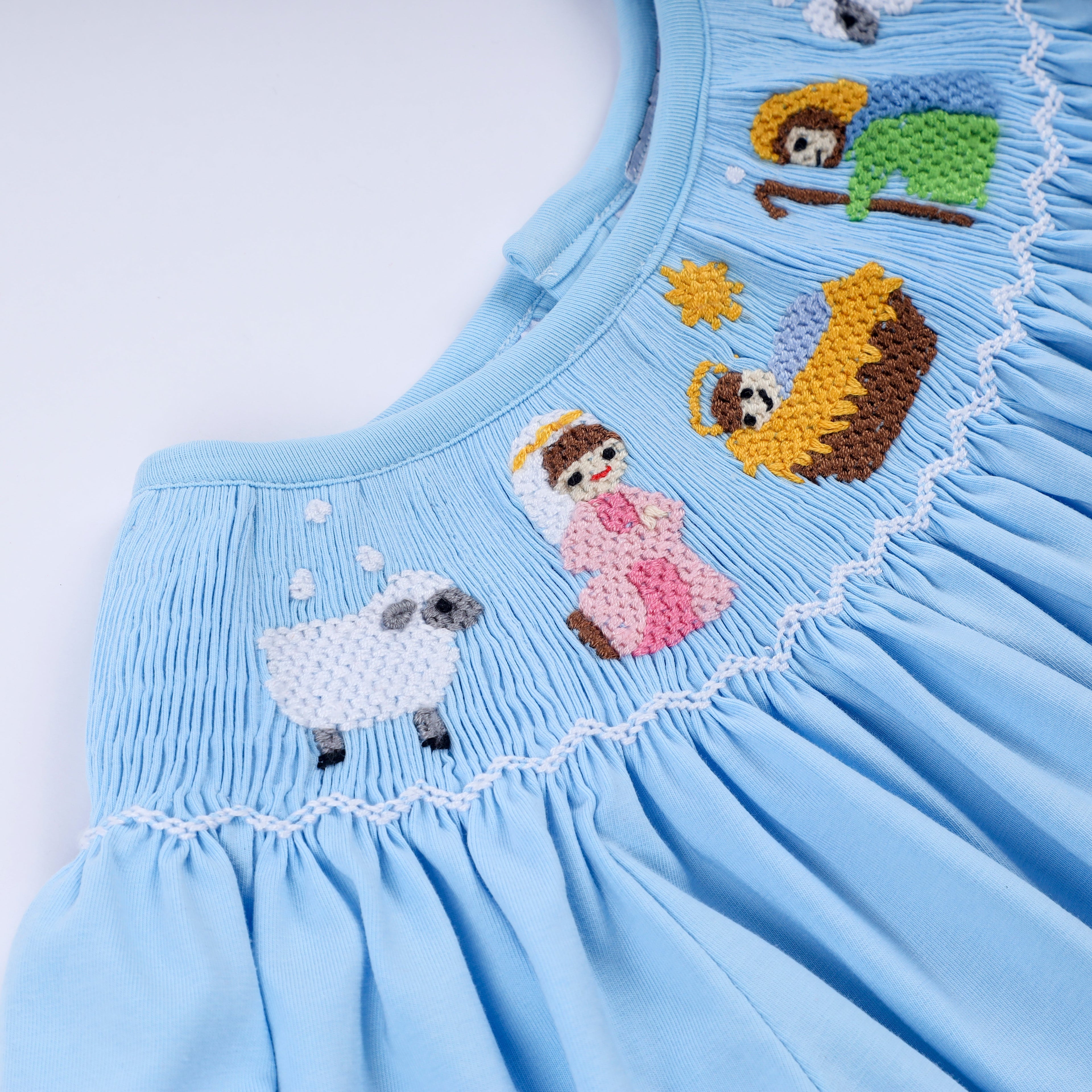 Robe bleue smockée à la main Nativité