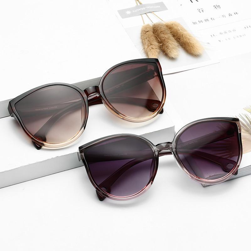 Lunettes de soleil de luxe modernes et élégantes pour femme avec monture en plastique œil de chat et verres transparents avec protection UV400