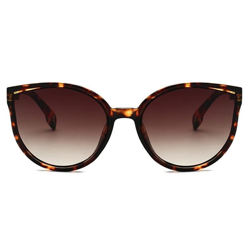 Lunettes de soleil de luxe modernes et élégantes pour femme avec monture en plastique œil de chat et verres transparents avec protection UV400