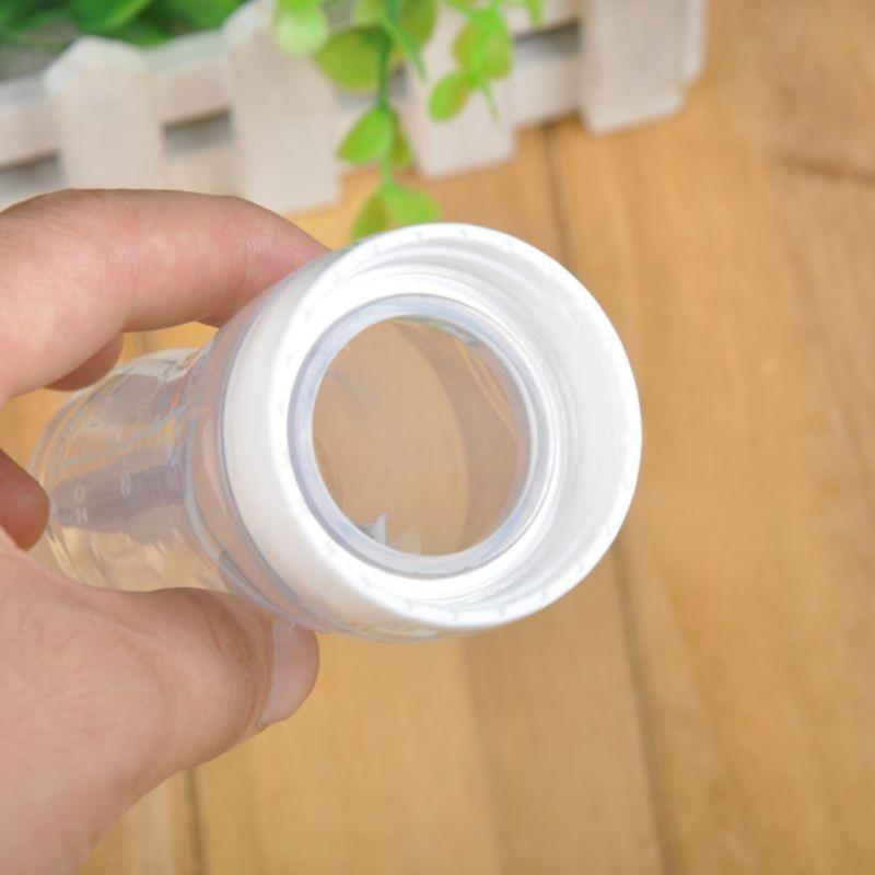 Biberon en silicone avec cuillère Bouteilles de complément alimentaire Bouteille de lait à presser avec cuillère Tasse pour bébé et enfant