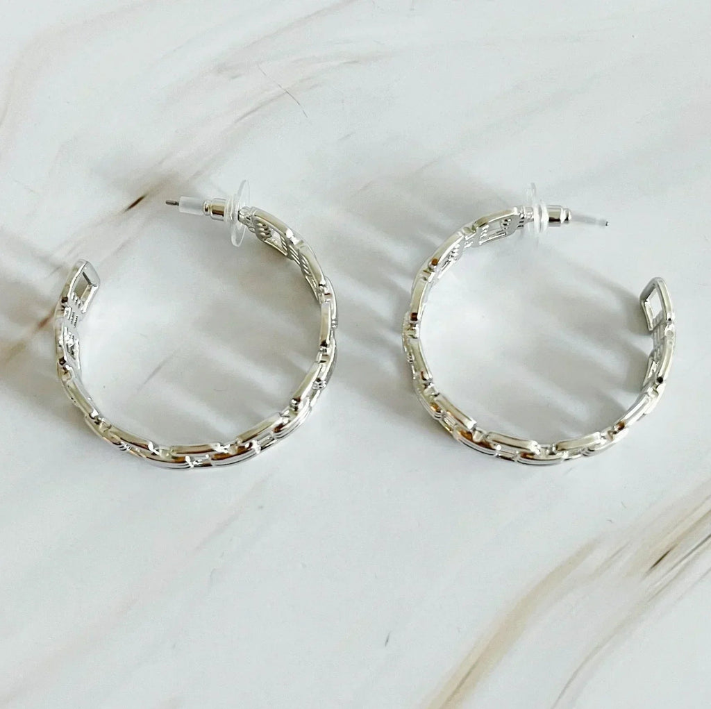Boucles d'oreilles créoles dorées entrelacées