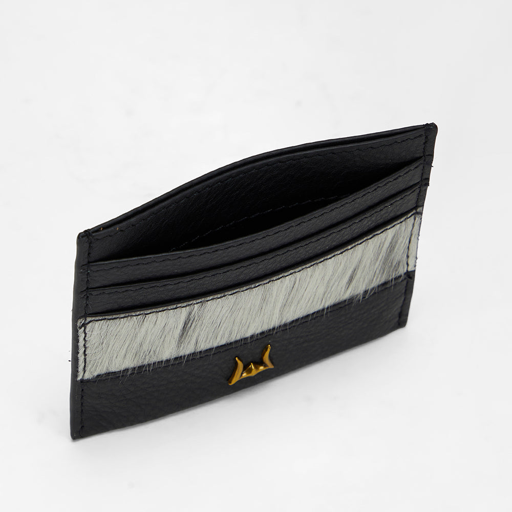 Loyal West PORTE-CARTES SHELL EN PEAU DE VACHE NOIRE ET BLANCHE