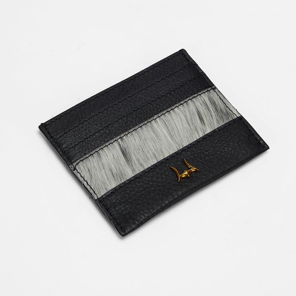 Loyal West PORTE-CARTES SHELL EN PEAU DE VACHE NOIRE ET BLANCHE
