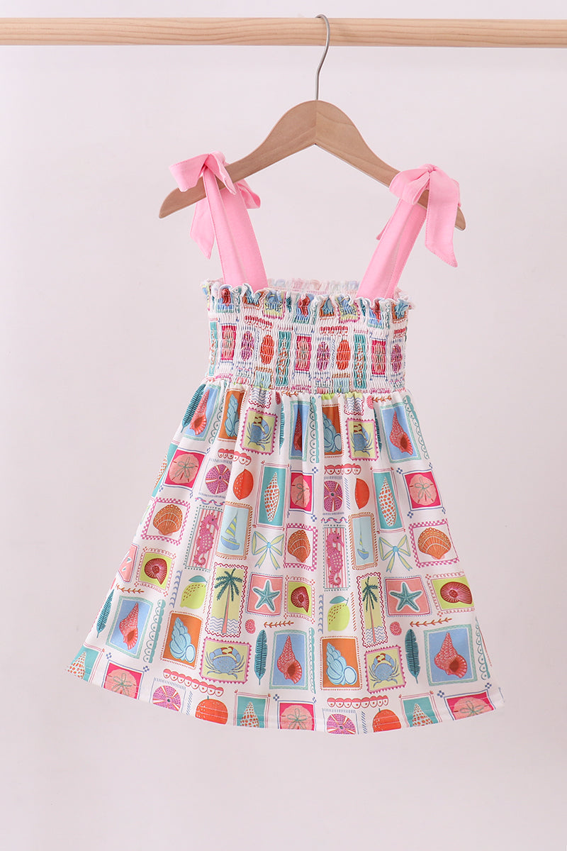 Robe smockée mère-enfant rose pour la plage