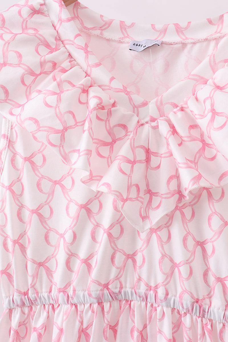 Robe rose à volants étagée et à nœud papillon