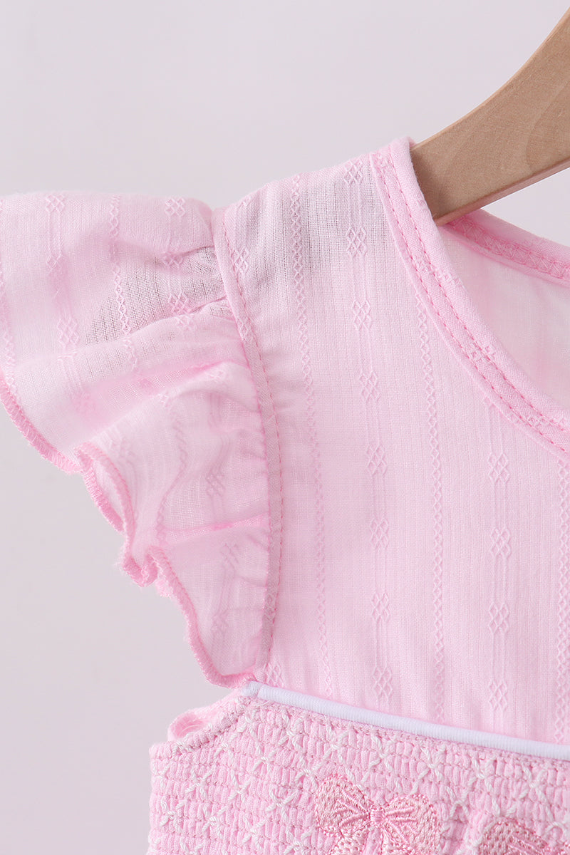 Robe smockée à volants et nœud rose