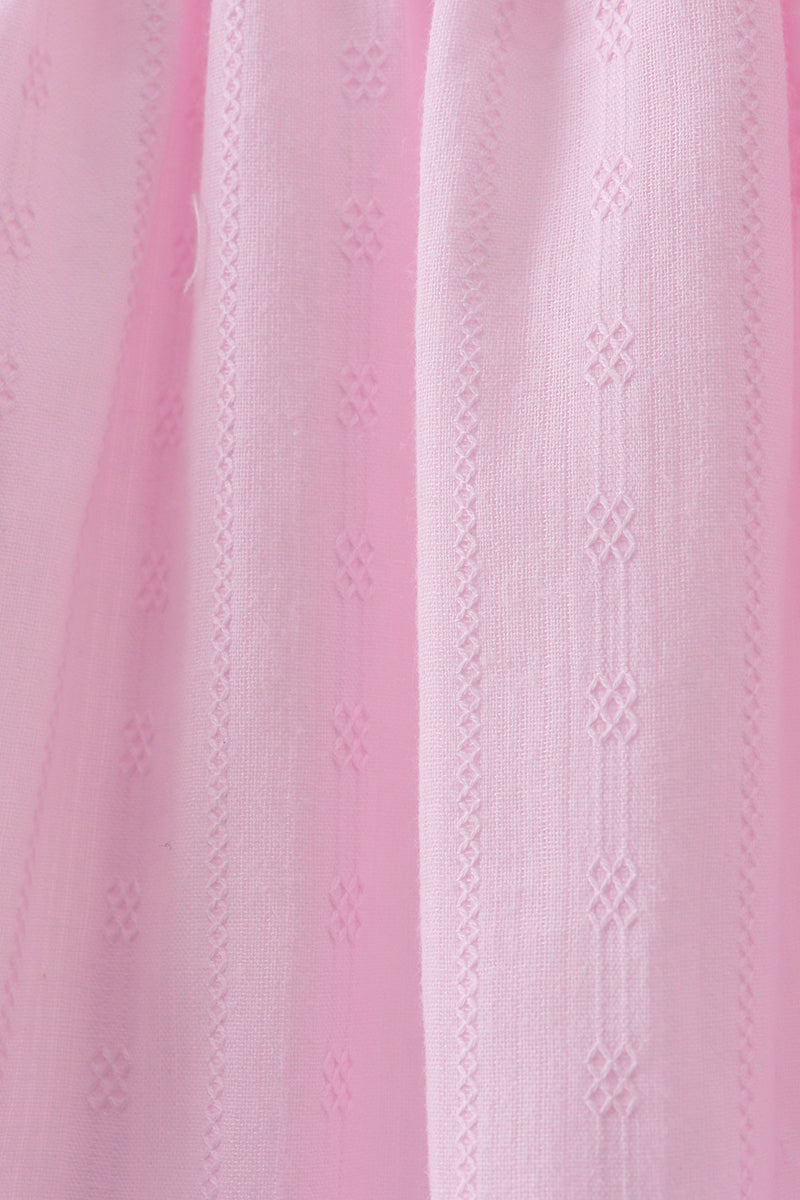 Robe smockée à volants et nœud rose