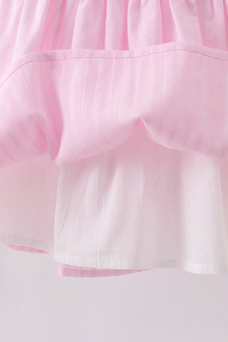 Robe smockée à volants et nœud rose