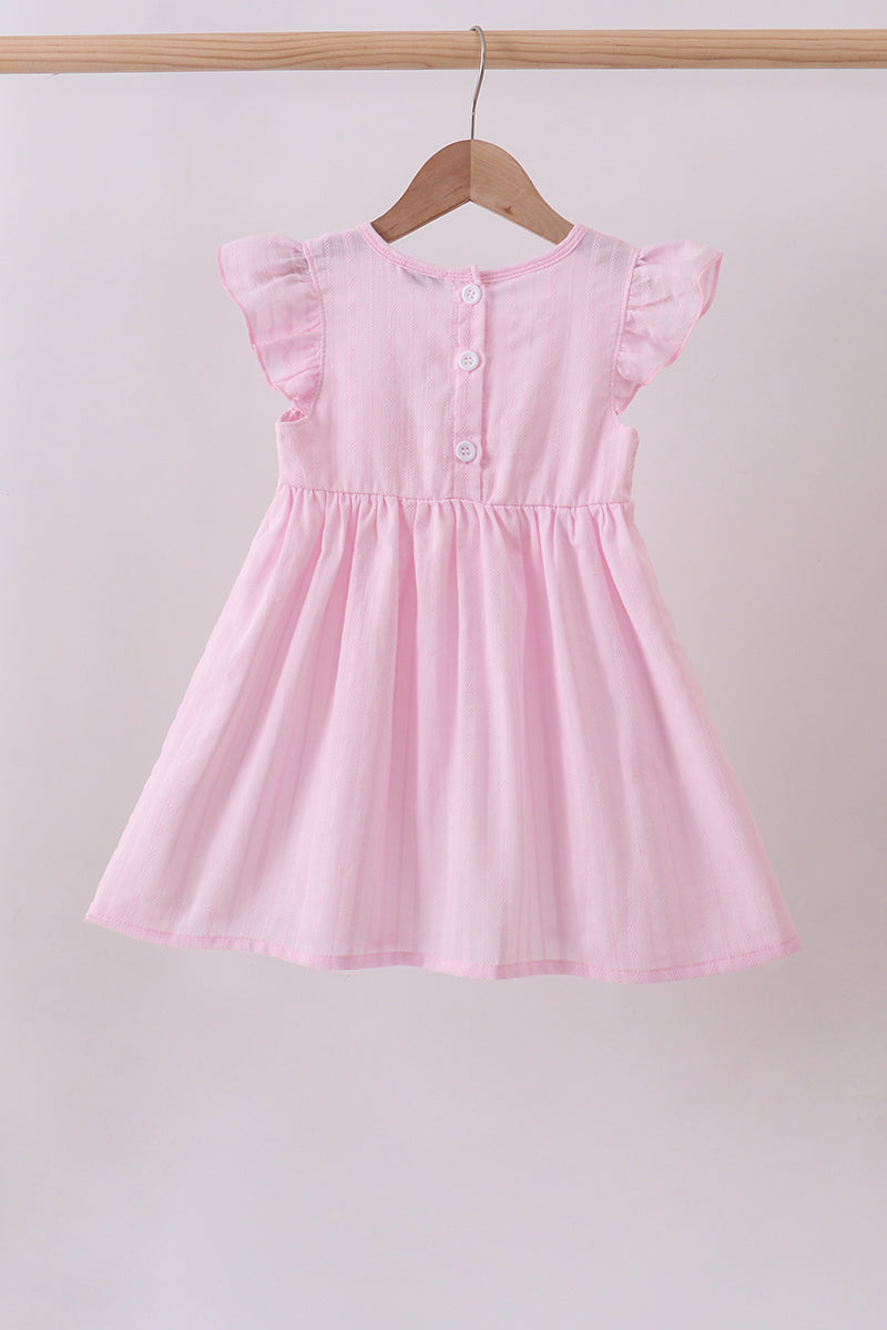 Robe smockée à volants et nœud rose