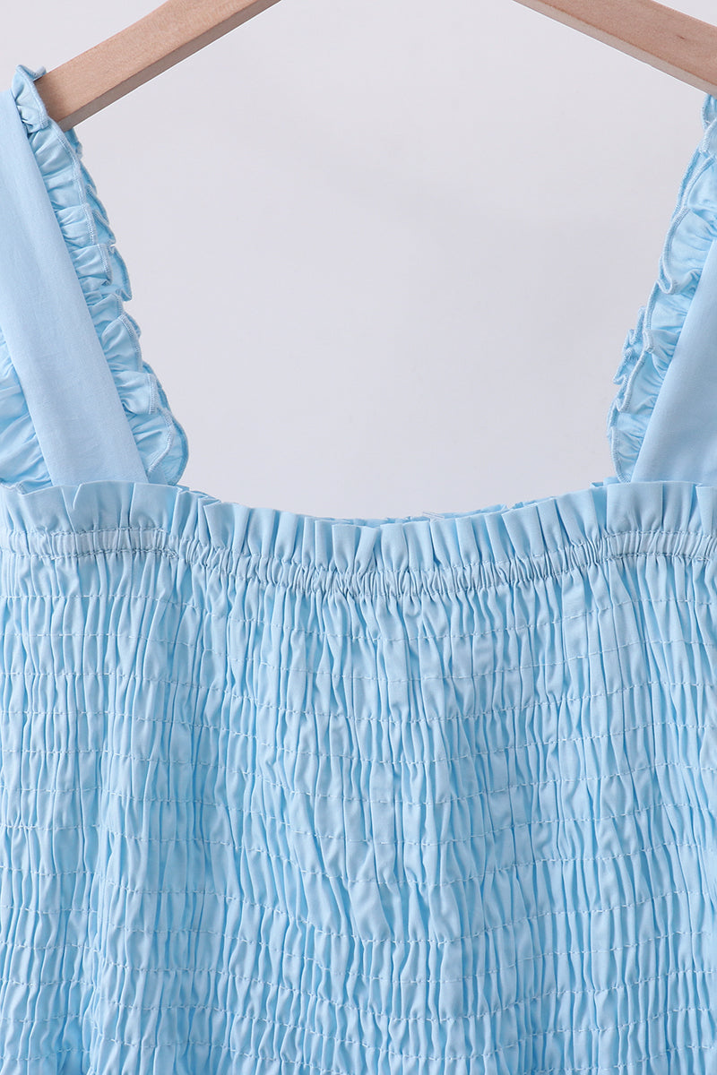 Robe bleue à volants étagés et smocks