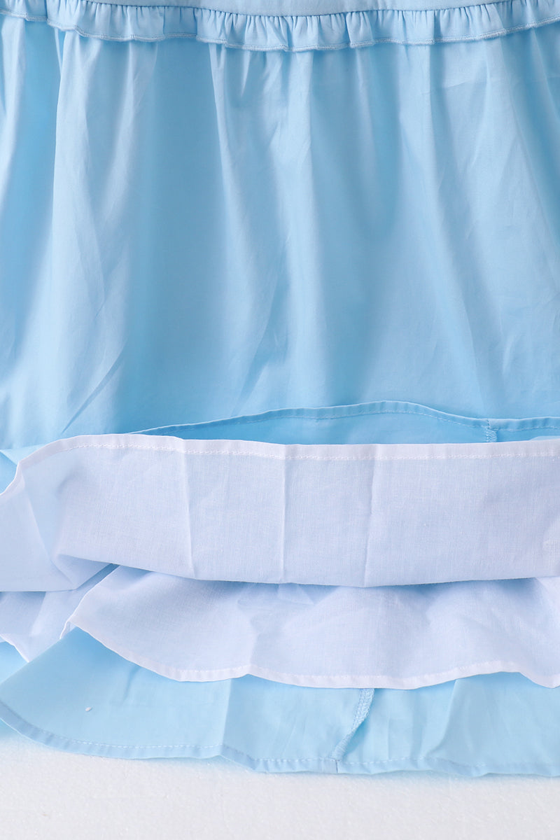 Robe bleue à volants étagés et smocks