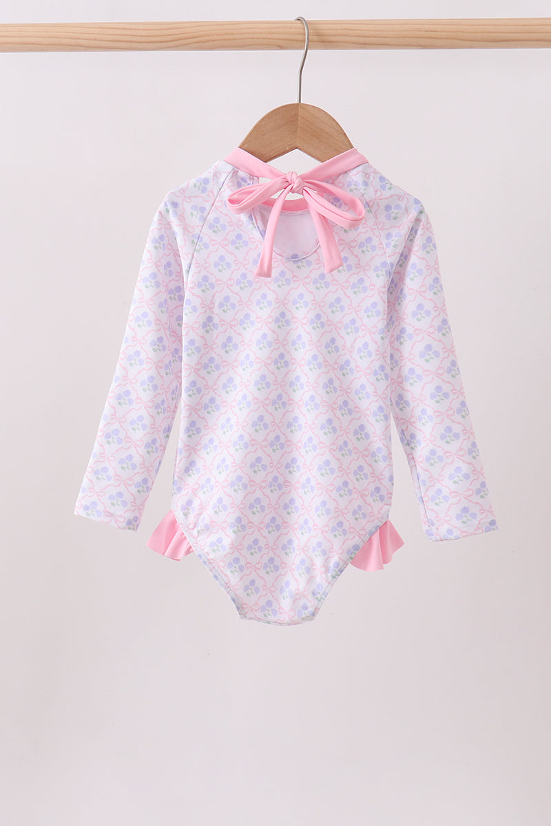 Haut anti-UV rose à volants imprimé floral
