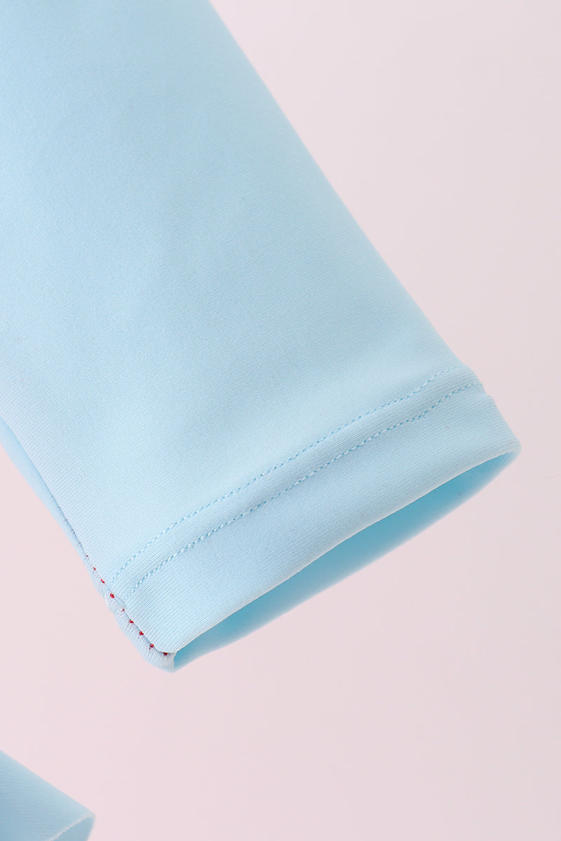 Haut de protection anti-UV à volants brodé étoile rouge
