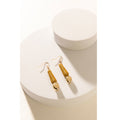 Boucles d'oreilles en or en forme de pépite brillante
