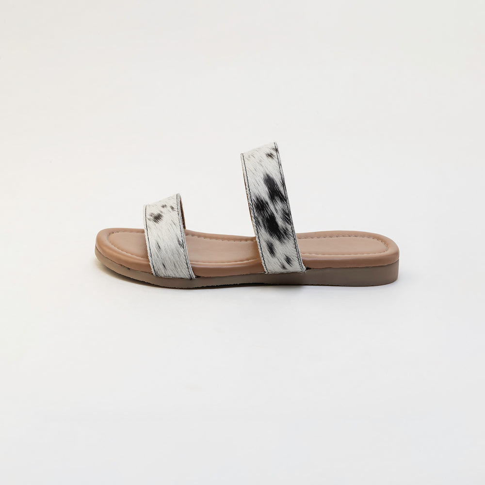 Sandales en cuir Vaquero avec poil façon poulain noir et blanc
