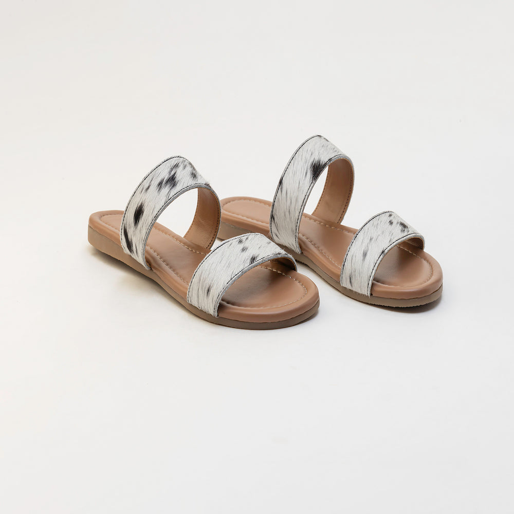 Sandales en cuir Vaquero avec poil façon poulain noir et blanc