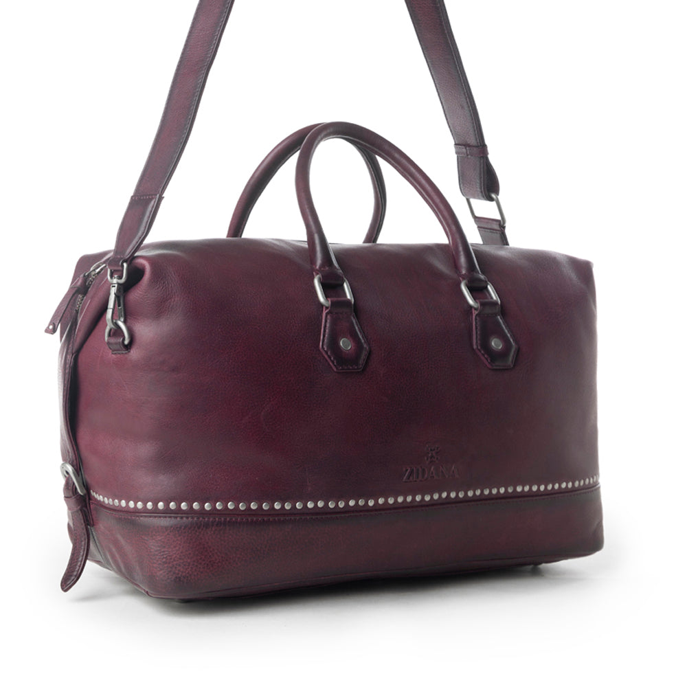Sac de voyage Myra Zidana en cuir tanné végétal coloris Dusty Berry