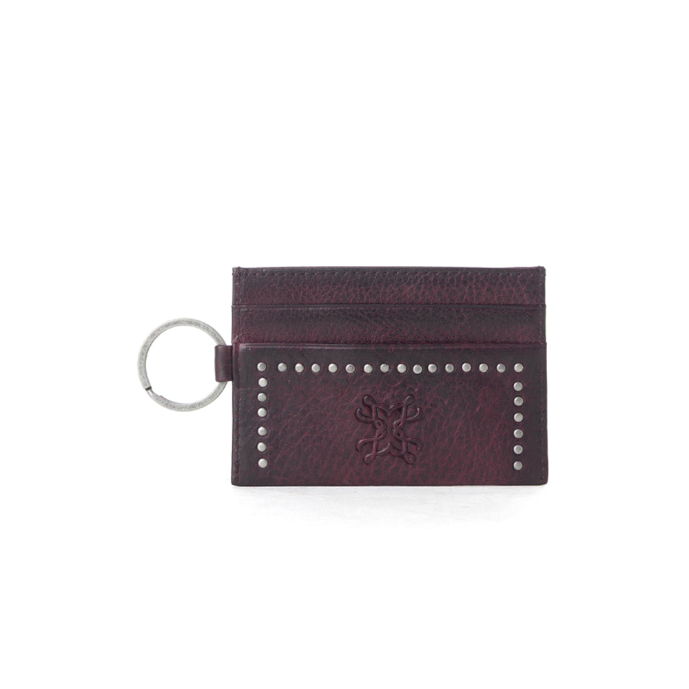 Portefeuille Myra Zidana Steelhoof en cuir tanné végétal clouté, couleur prune sienne