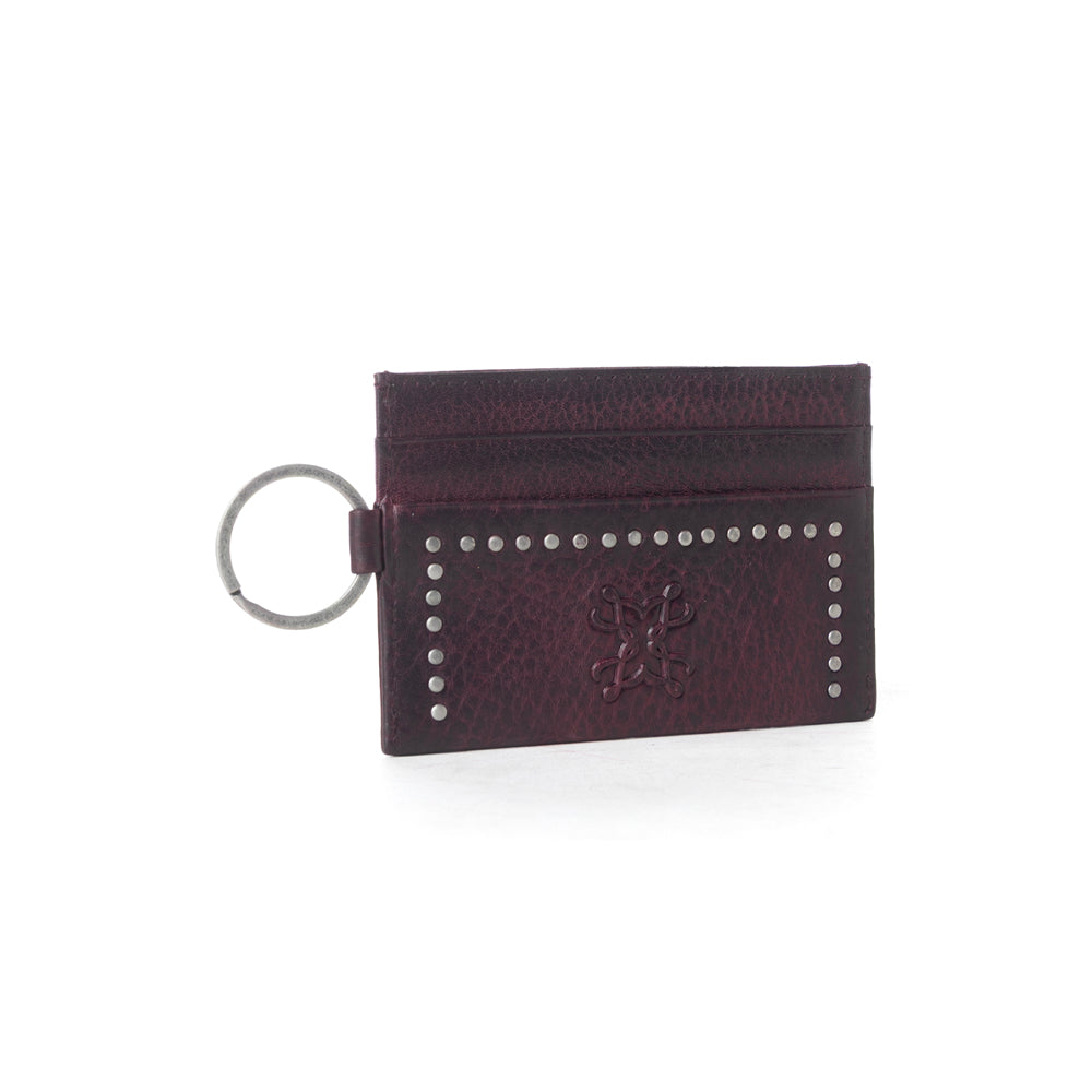 Portefeuille Myra Zidana Steelhoof en cuir tanné végétal clouté, couleur prune sienne