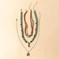 Collier à plusieurs rangs Myra Cody Charm pour femme avec perles turquoises et détail fer à cheval pour un style western