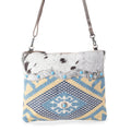 Sac bandoulière Myra Tufts tissé en poil de vachette – Imprimé géométrique tribal avec sangle en cuir et détails cloutés