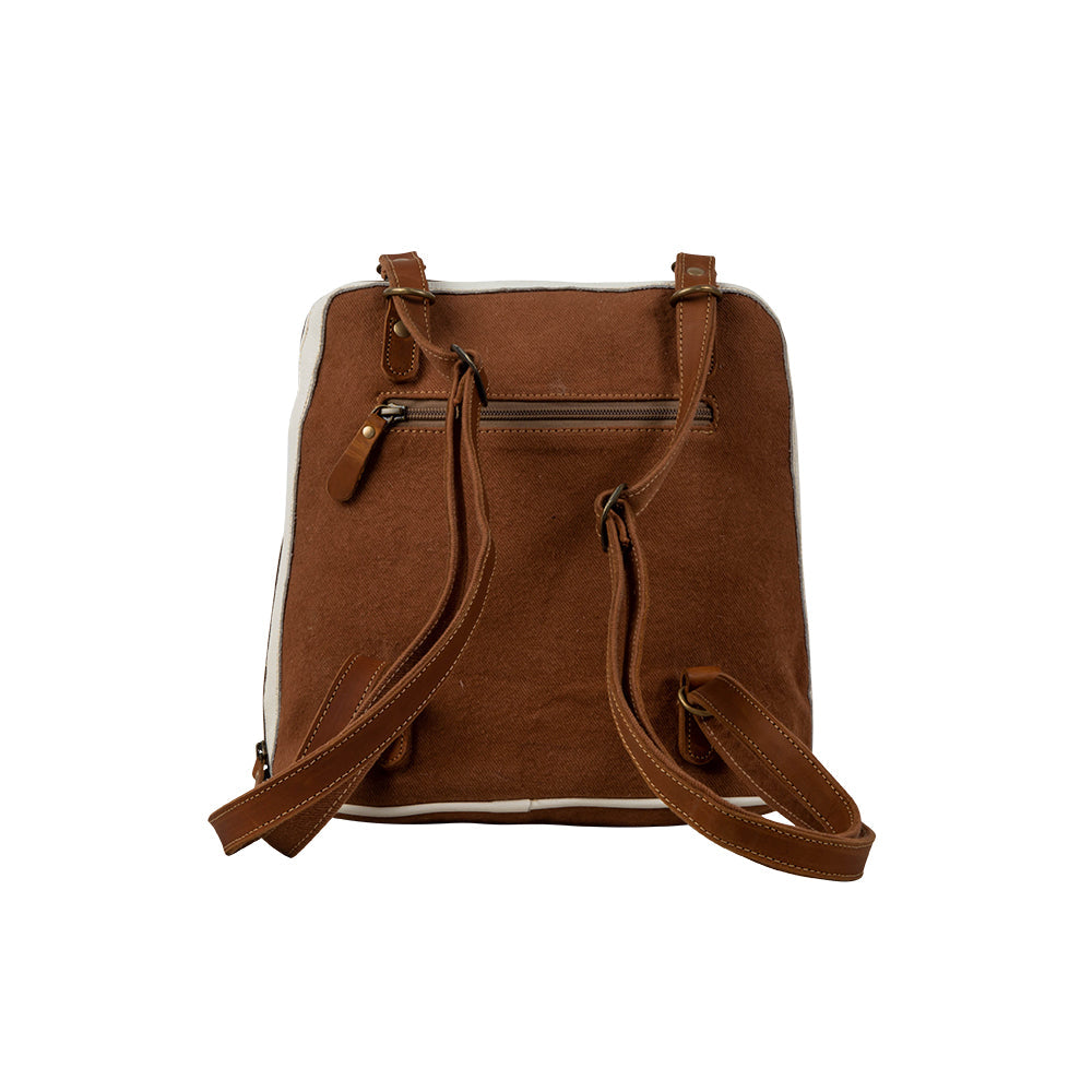 Sac à dos en toile et cuir de vachette à motif herbes des prairies.