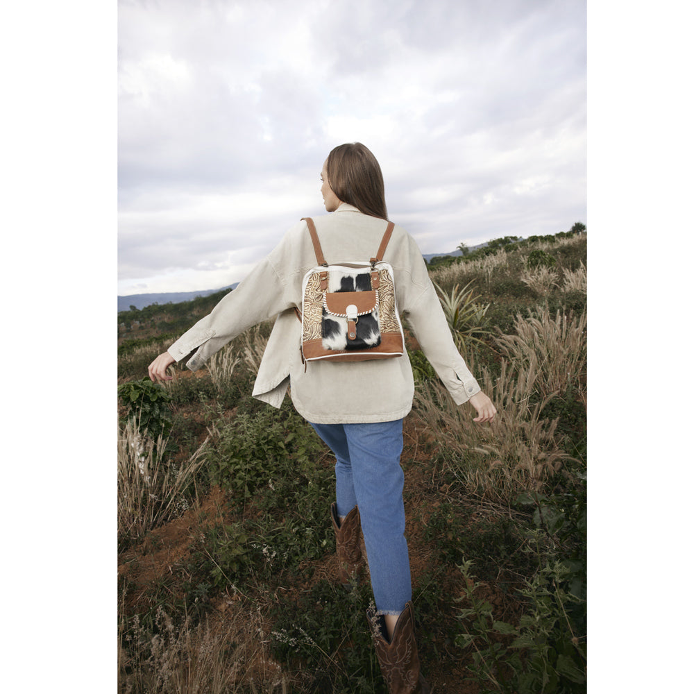 Sac à dos en toile et cuir de vachette à motif herbes des prairies.