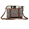 Sac Clara Mae en toile accentuée de cuir gravé et de poil sur cuir