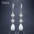ZAKOL Boucles d'oreilles pendantes rondes imitation perles pour femmes, brillantes, en zircone et cristal, feuilles longues, bijoux de mariée pour mariage