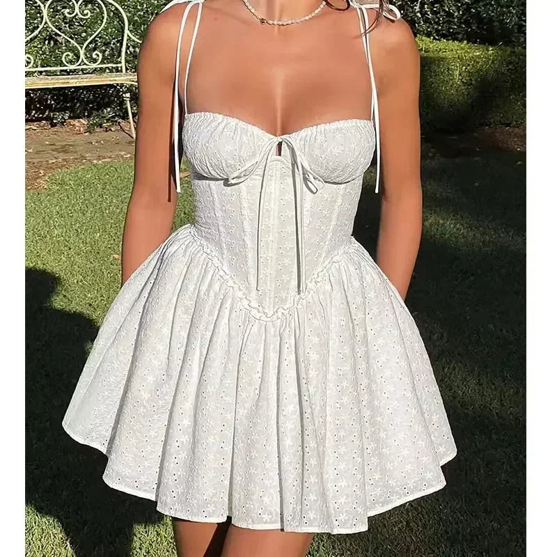 YENKYE Sexy Elegant Women Hollow Out Embroidery Yellow Sling Mini Dress Low Waist Lace Up Bandage Party Dresses Birthday Robe