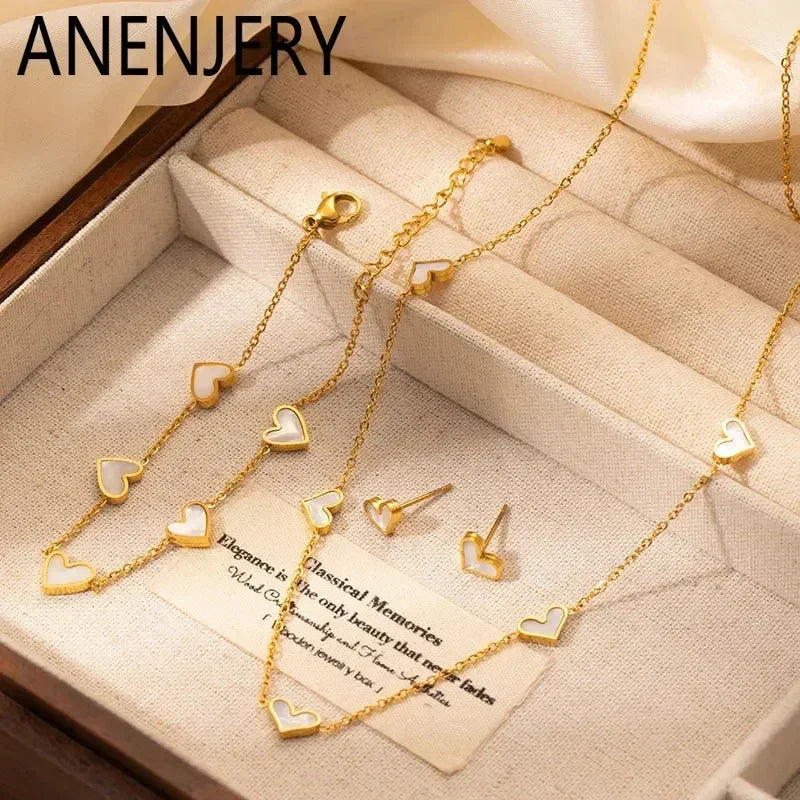 Parure de bijoux en acier inoxydable 316L ANENJERY avec collier, bracelet et boucles d'oreilles en forme de cœur et coquille pour femmes et filles, style simple et tendance, cadeaux en gros
