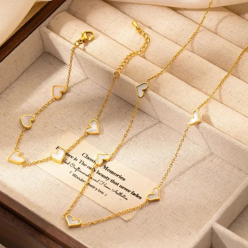 Parure de bijoux en acier inoxydable 316L ANENJERY avec collier, bracelet et boucles d'oreilles en forme de cœur et coquille pour femmes et filles, style simple et tendance, cadeaux en gros