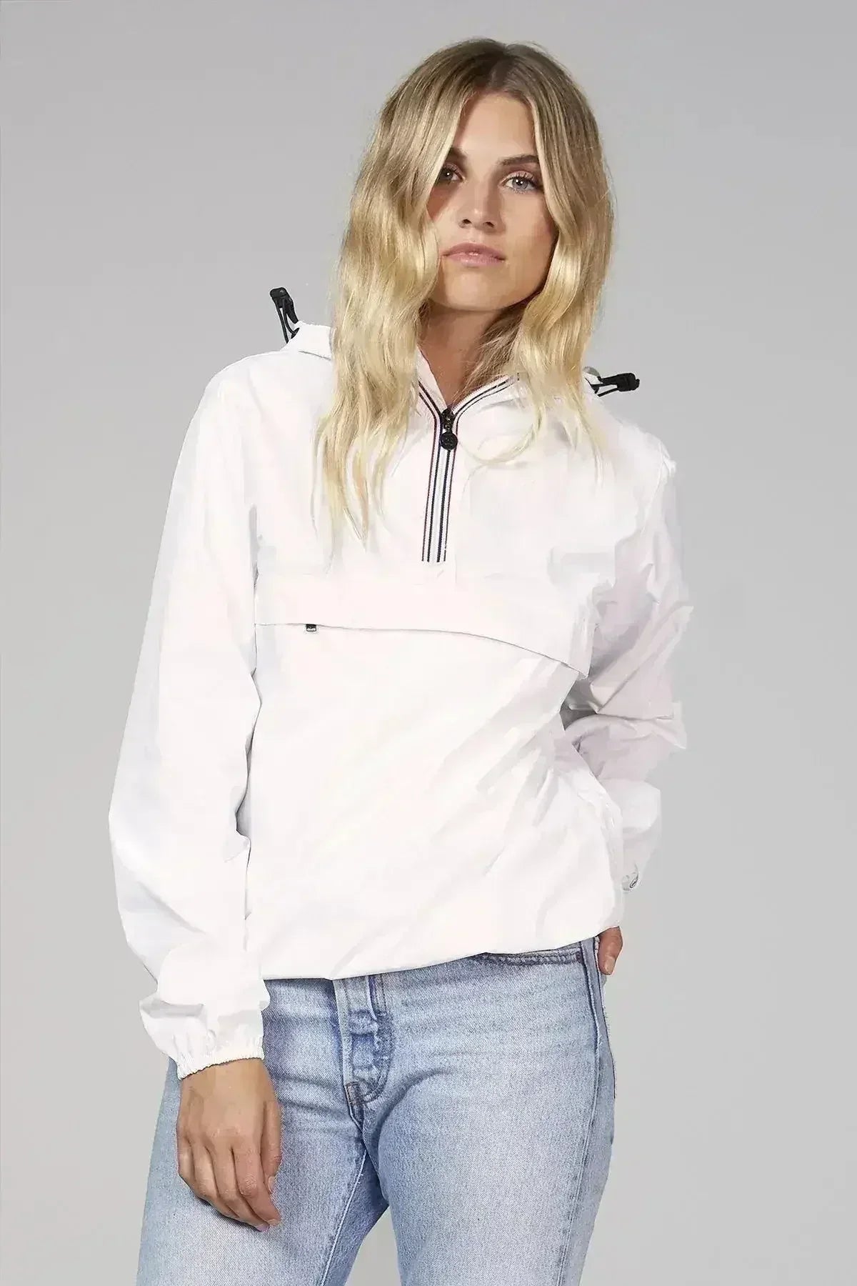 Imperméable coupe-vent blanc compressible avec fermeture éclair au quart