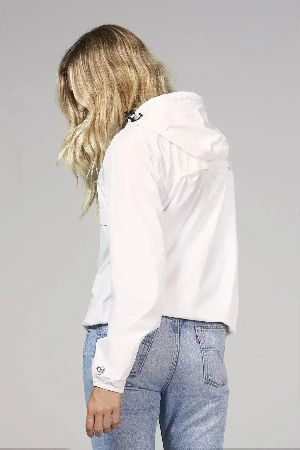 Imperméable coupe-vent blanc compressible avec fermeture éclair au quart